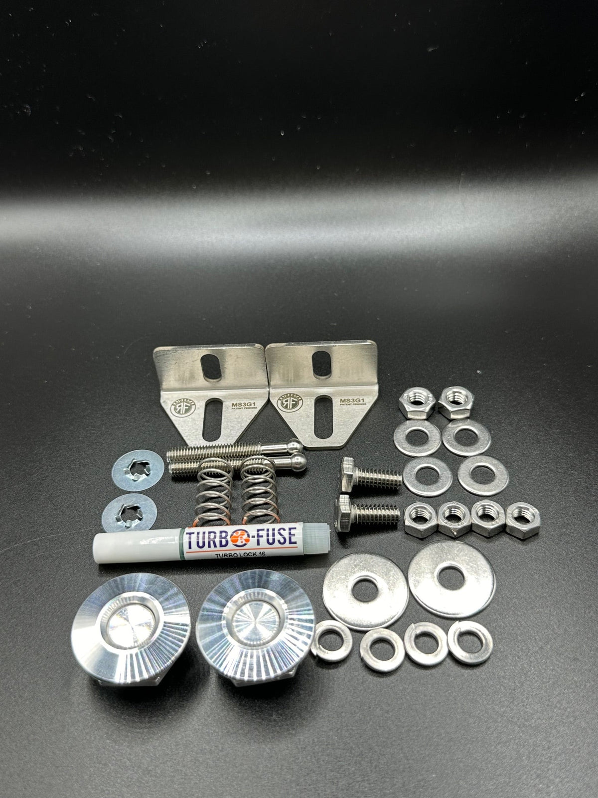 RaiderFab first-generation Mazda3 fenderwell kit with two machined aluminum latches, brackets and hardware.
