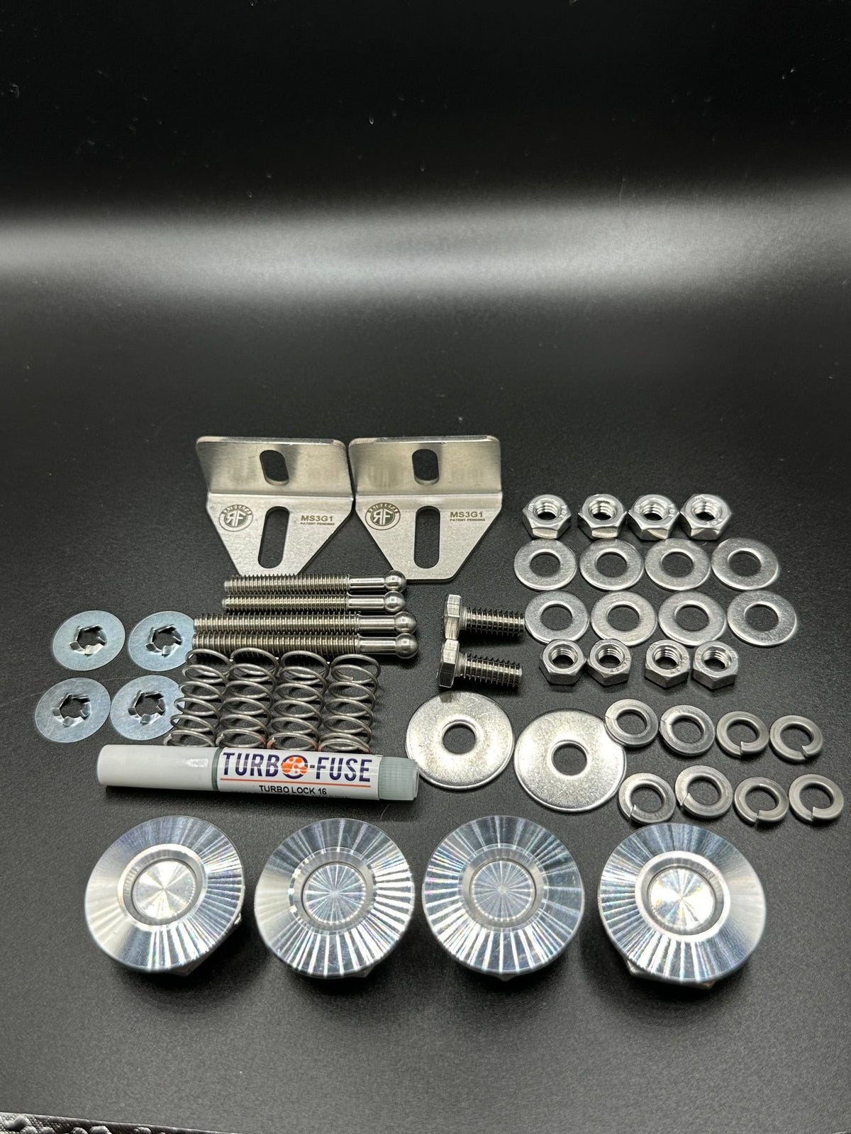 RaiderFab first-generation Mazda3 full kit with four machined aluminum latches, brackets and mounting hardware.